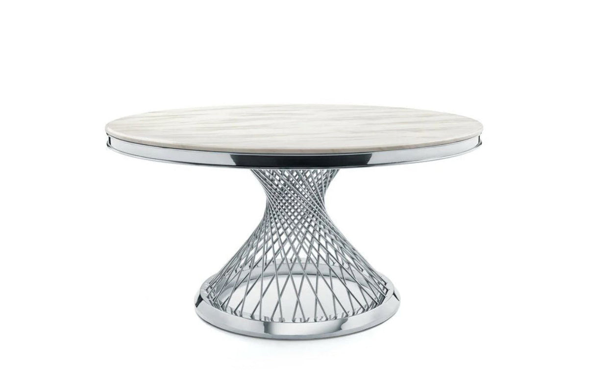 Architectural gold metal base of the Carter dining table highlighting the geometric structural design.