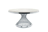 Architectural gold metal base of the Carter dining table highlighting the geometric structural design.