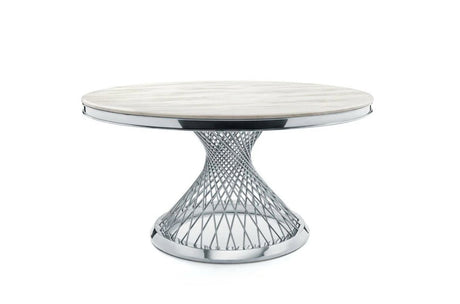 Architectural gold metal base of the Carter dining table highlighting the geometric structural design.