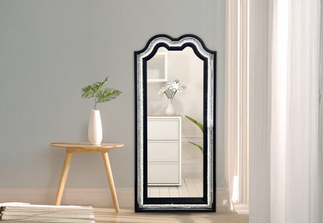 The Nini LED wall mirror mounted in a contemporary bedroom setting for functional grooming and decor.