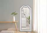 Front view of the Nini LED wall mirror with integrated crystal accents and glowing light strips.