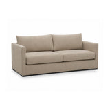 Portsmouth 85 Inch Sofa brown variant angled view in styled lounge interior