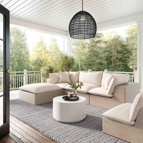 Angled perspective of Cream Fabric and Natural Wicker Cali Outdoor Ottoman