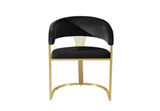 Detail of curved gold metal legs on FOAK dining chair.
