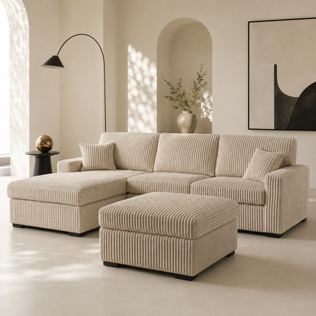 A modern beige striped sectional sofa with a chaise lounge and matching ottoman in a bright, minimalist living room.