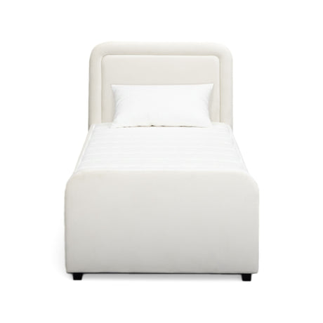 Full room view showing the Briella Performance Velvet Bed in an open concept layout
