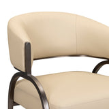 Close-up detail of the smooth taupe performance vegan leather upholstery and perimeter stitching