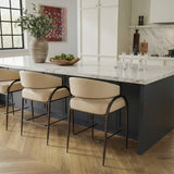 Tatum counter stool side profile showing black iron frame and vegan leather seat cushion