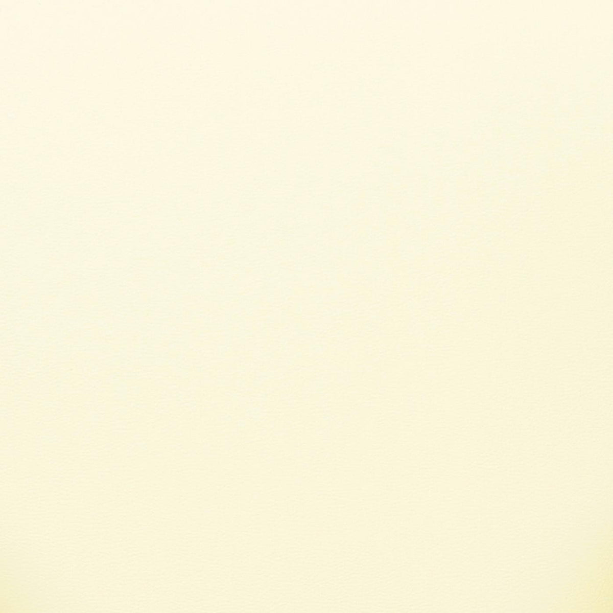 Material texture close-up of the Cream vegan leather upholstery on the Tatum chair