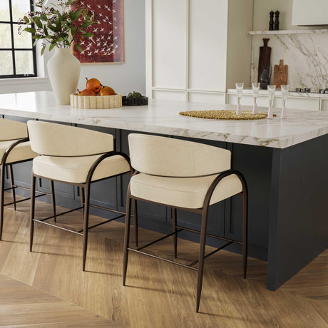Cream vegan leather Tatum counter stool side view highlighting geometric iron frame