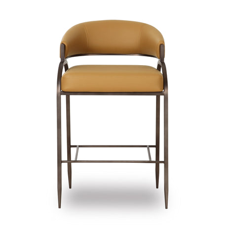 Set of tan Tatum counter stools lined along a natural stone kitchen island