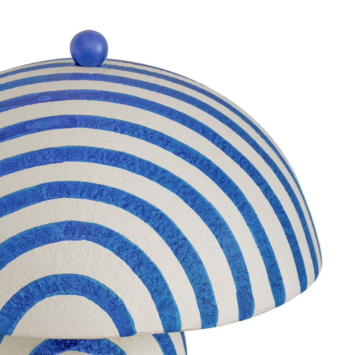 High-angle view of domed papier mache shade and circular base
