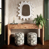 Dex round fabric ottoman from low perspective angle