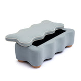 Thalia blue velvet storage bench placed under a window in living room