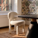 Manu Performance Fabric Side Chair styled beside a wooden modern dining table