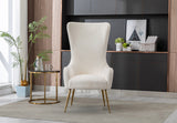 Detail view of the gold-tone metal legs on the Blair chair.