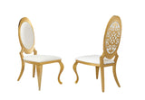 Black velvet upholstered dining chair showing curved gold metal frame