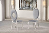 Side profile of the black velvet dining chair highlighting the curved silver-finished legs and ergonomic back.