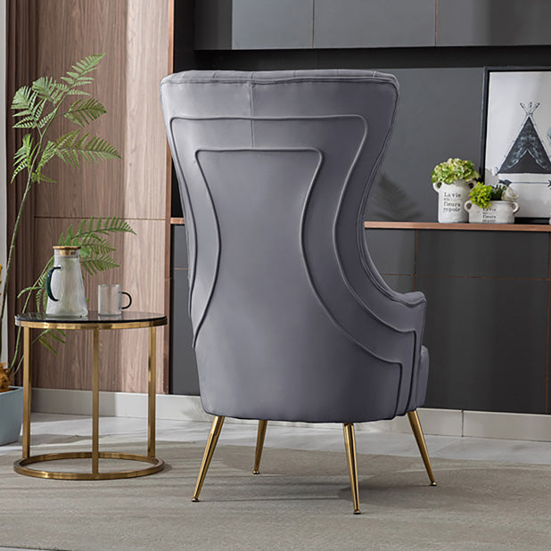 Front view of contemporary gray velvet armchair showing tufted backrest