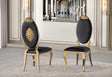 Front view of the Yara black velvet dining chair featuring an ornate gold oval backrest and gold legs.