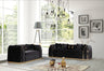 Charisma living room set by FOAK featuring a durable sofa and matching loveseat.