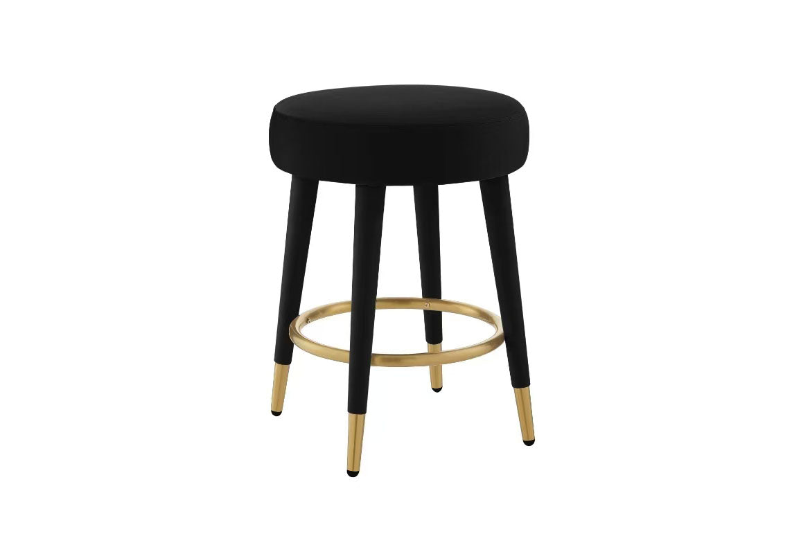 FOAK velvet counter stool positioned against a modern white kitchen island.