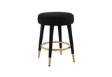 FOAK velvet counter stool positioned against a modern white kitchen island.