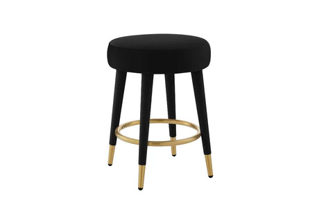 FOAK velvet counter stool positioned against a modern white kitchen island.