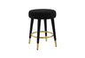 FOAK velvet counter stool positioned against a modern white kitchen island.