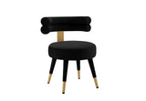 Velora dining chair positioned in a modern dining room setting with gold accents.