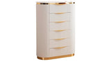 King size white velvet bed frame with gold metal accents in a modern room.