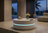 Orea Halo round coffee table with vertical fluted texture and integrated ambient lighting base.