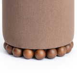 Top cushion firmness demonstration on Dex round ottoman