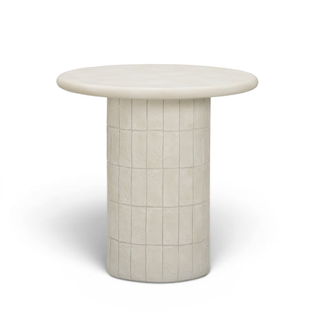Top-down view of smooth beige cast concrete round side table surface