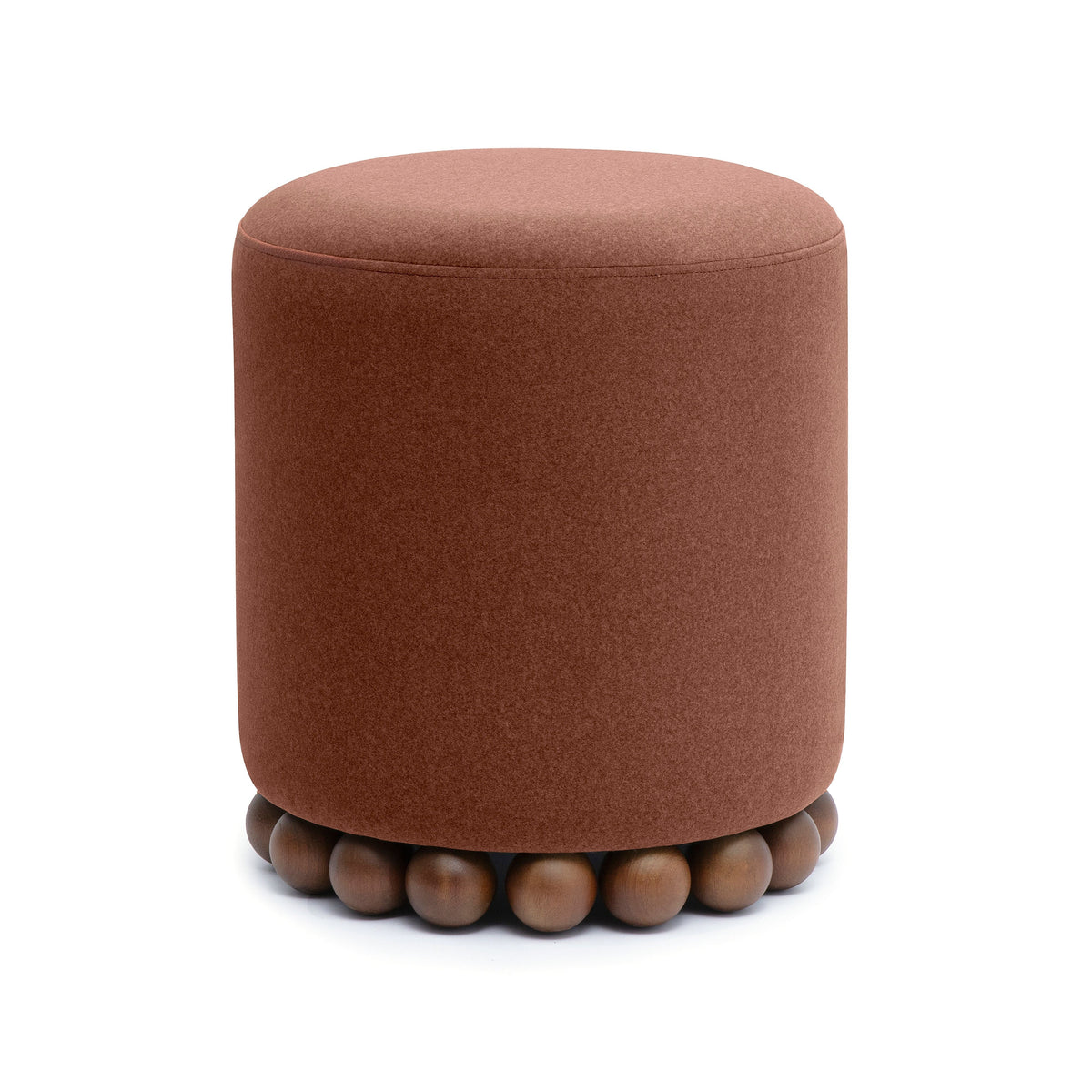 Dex circular accent stool resting on hardwood floor