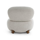 Pucker Accent Chair arranged beside a wooden side table in an organic modern living room