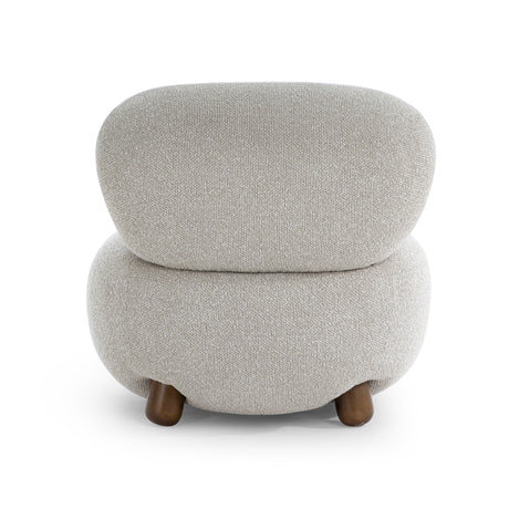 Pucker Accent Chair arranged beside a wooden side table in an organic modern living room