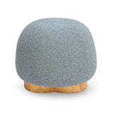 Oopa Swivel Ottoman placed alongside an organic modern coffee table