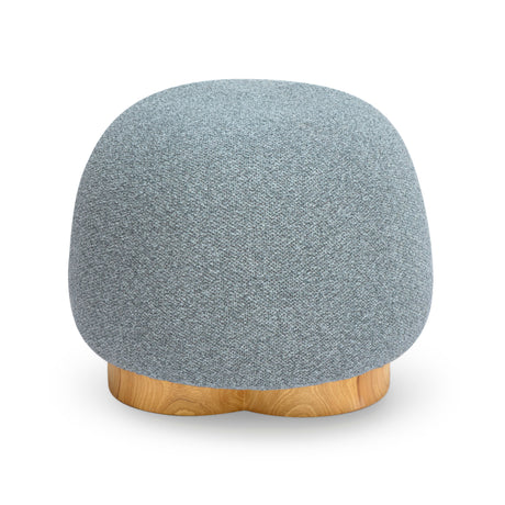 Oopa Swivel Ottoman placed alongside an organic modern coffee table