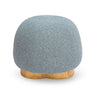 Oopa Swivel Ottoman placed alongside an organic modern coffee table