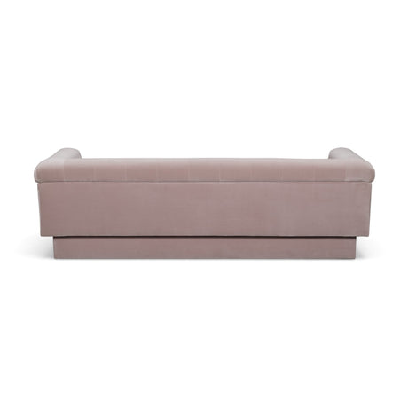 Close-up view of velvet fabric texture and tufted depression details