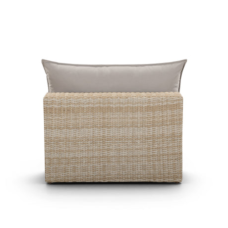 Side profile of the Cali modern outdoor armless slipper chair displaying wicker weave texture