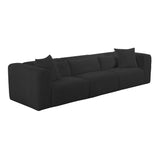 Tarra 118-Inch Modular Sofa styled with textured throw pillows in ambient light