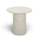 Top-down view of smooth beige cast concrete round side table surface