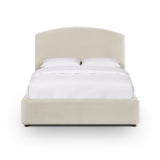 Footboard detail and low-profile upholstered side rails of Leah chenille bed