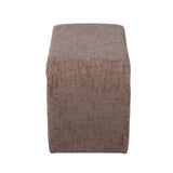 Alvie upholstered side table styled with books on the bottom shelf