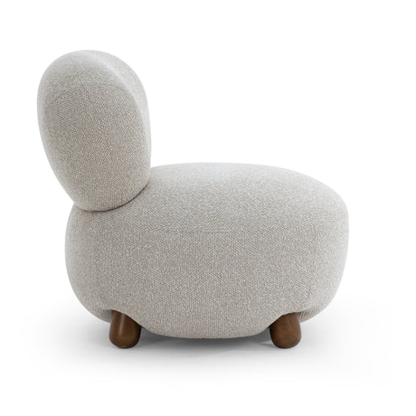 Rear perspective of the Pucker Accent Chair showcasing seamless upholstered back