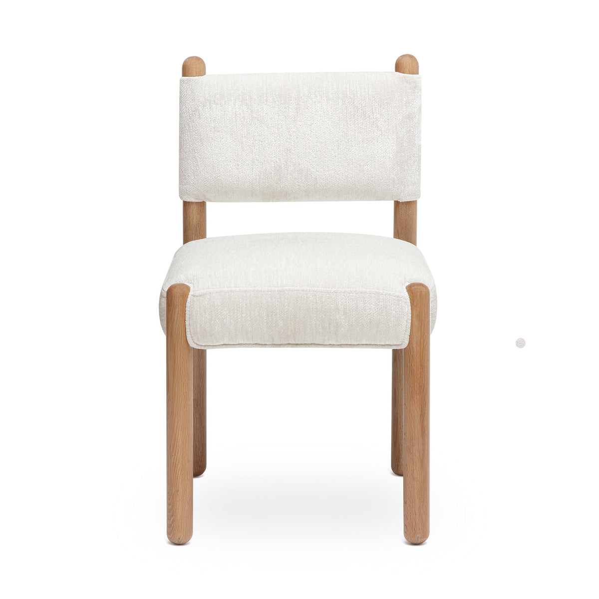 Bruno performance chenille dining chair placed beside a contemporary wooden dining table