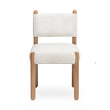 Bruno performance chenille dining chair placed beside a contemporary wooden dining table