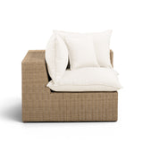 Back profile of brown woven wicker frame on Cali outdoor corner chair